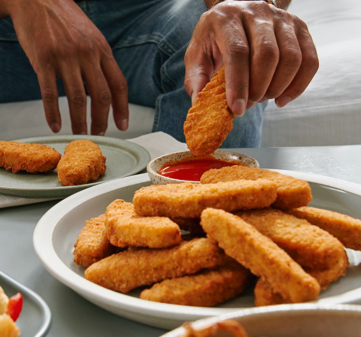 Beyond Chicken Tenders being dipped in ketchup