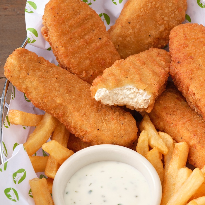 Beyond Chicken Tenders in basket with fries